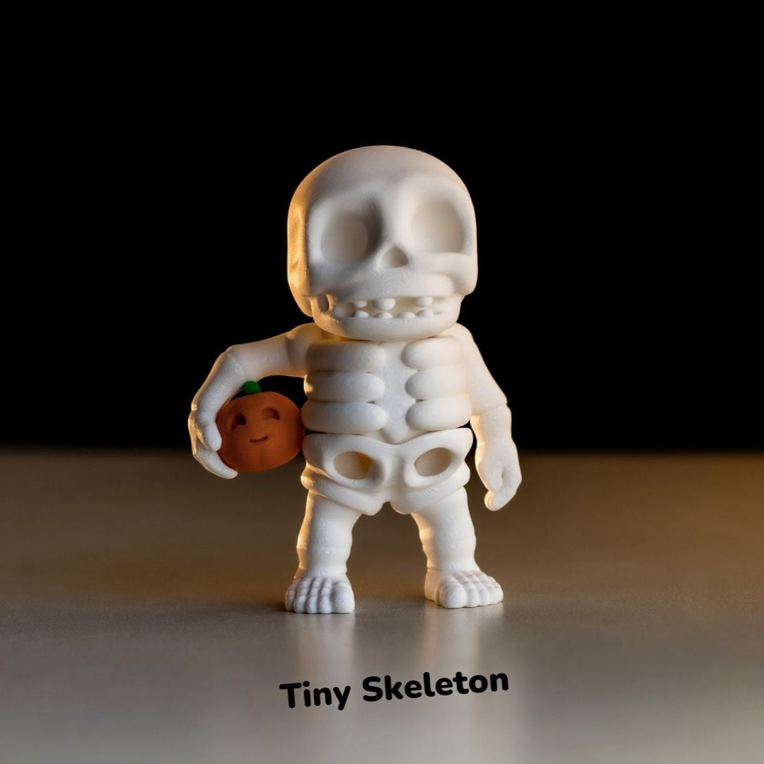 Tiny Skeleton Holding Pumpkin fidget Keychain - Tiny Lowlanders